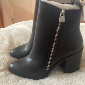 Short black booties with zippers
